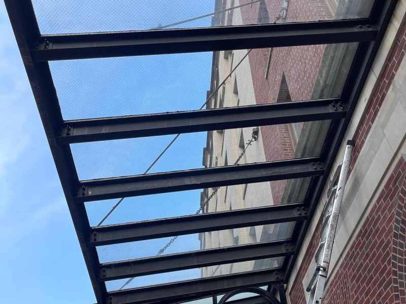 Glass Canopies in NYC: Entrance Canopies for Storefronts, Hotels & Offices 4 View from below a commercial glass canopy in Manhattan
