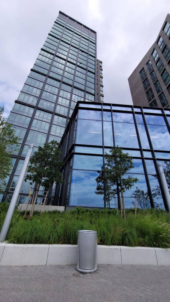 Curtain wall glazing detail showing aluminum mullions and insulated glass