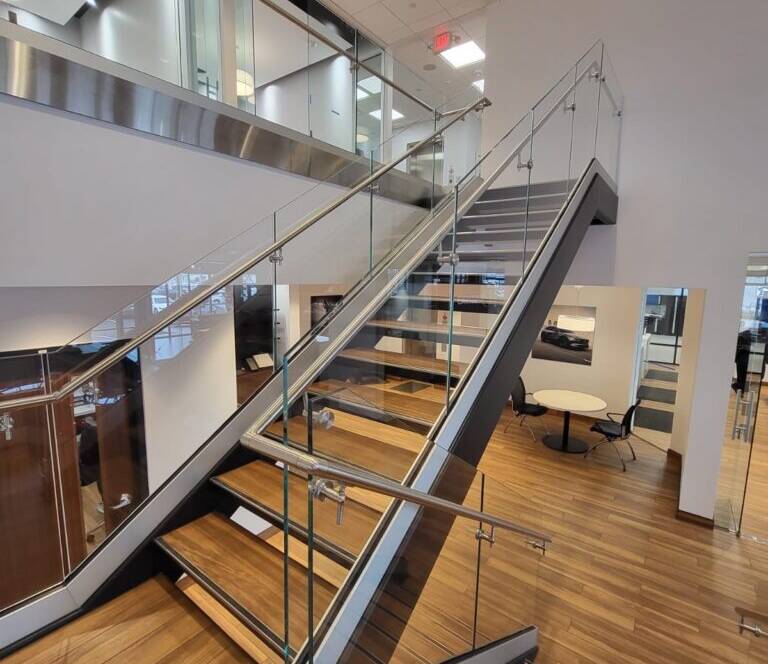 Glass stair railing installed in a NYC commercial space