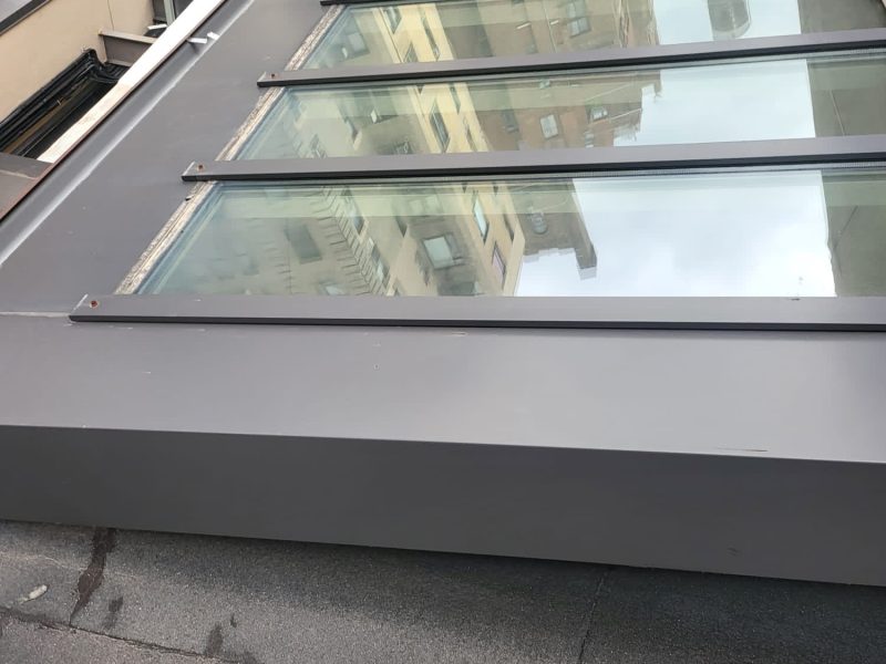 Skylight Leak Repair in NYC: Fix It Before Winter 2 Flat glass skylight perimeter seal on a New York City rooftop